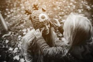 Mother with daughter in autumn park photo