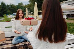 Girls throws gifts to each other photo