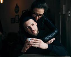 young man and woman posing indoors photo