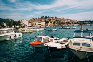 Moored yachts stand in the port town photo