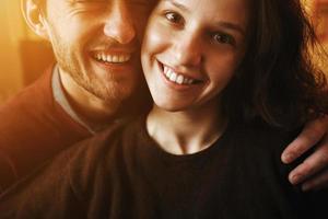 Vintage couple hugs and laughing .Coffee shop photo