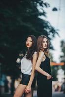 pretty girls posing in a city street photo