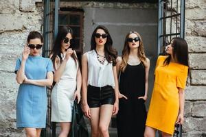 Five young beautiful girls in the city photo