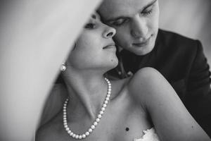 Beautiful European bridal couple in the hotel room photo