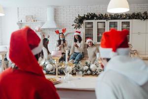 Multi-ethnic young people celebrating New year eve at party photo