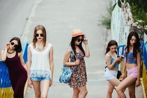 Five young beautiful girls in the city photo