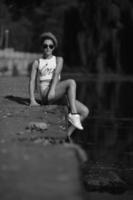 beautiful girl sitting on the pier photo