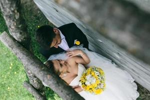 beautiful young wedding couple outdoors photo