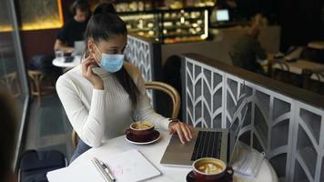 Three women having a meeting at coffee shop video