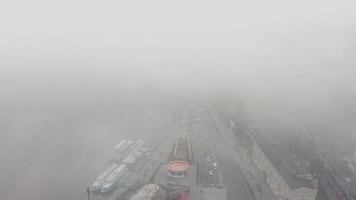 Cars travel through fog a on road near Dnieper River in Kyiv, Ukraine video