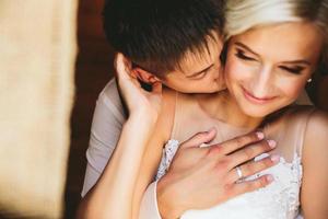 Beautiful wedding couple in doorway photo