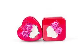 Heart-shaped iron box and Rectangular iron box, decorated with pink artificial flowers, and a greeting card isolated on white background with Clipping path photo