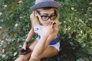 beautiful girl sitting and looking to the side photo