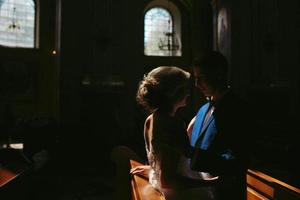 bride and groom illuminated by light photo