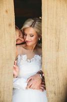 Beautiful wedding couple in doorway photo