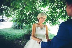 bride and groom dancing in nature photo