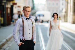 bride and groom on the street photo