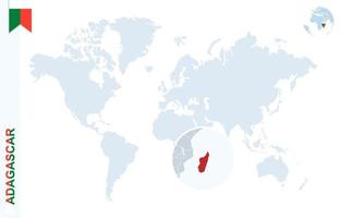 Blue world map with magnifying on Madagascar. vector