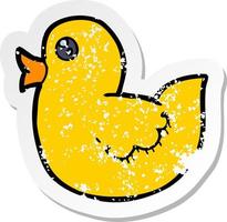 retro distressed sticker of a cartoon rubber duck vector