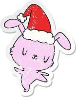 christmas distressed sticker cartoon of kawaii rabbit vector