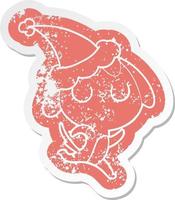 cute cartoon distressed sticker of a dog wearing santa hat vector