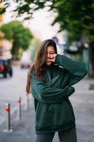 Portrait of cute girl with long hair looks at the camera photo