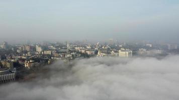 Aerial view of the city in the fog. photo