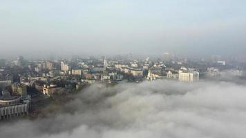 Aerial view of the city in the fog. photo