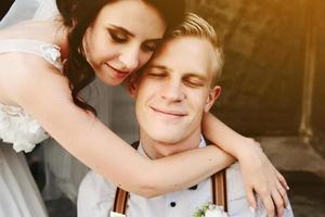 Bride leaning on the groom photo