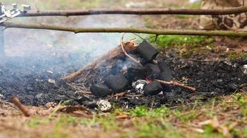 Man making a fire in the forest photo