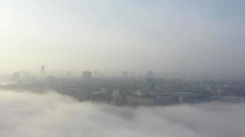 Aerial view of the city in the fog. photo