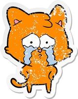 distressed sticker of a cartoon crying cat vector