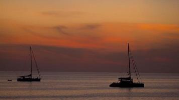 Timelapse of sunset over ocean landscape, Nai Harn beach, Phuket, Thailand video