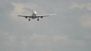 Widebody airplane approaching before landing in Amsterdam airport video