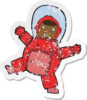 retro distressed sticker of a cartoon astronaut vector