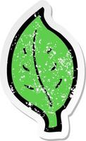 retro distressed sticker of a cartoon leaf vector