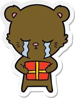 sticker of a crying cartoon bear with present vector