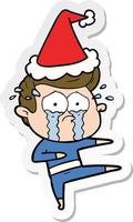 sticker cartoon of a crying dancer wearing santa hat vector