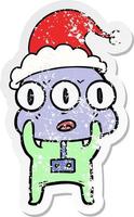 distressed sticker cartoon of a three eyed alien wearing santa hat vector