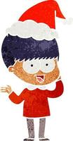 happy retro cartoon of a boy wearing santa hat vector