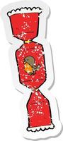 retro distressed sticker of a cartoon christmas cracker vector