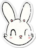 distressed sticker of a cartoon bunny face vector