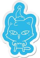 pegatina de dibujos animados de un gato con sombrero de santa vector