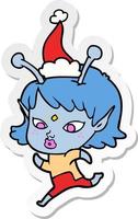 pretty sticker cartoon of a alien girl running wearing santa hat vector