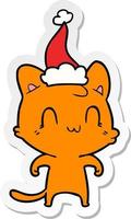 sticker cartoon of a happy cat wearing santa hat vector