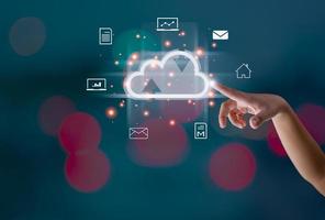 Finger pointing at the hologram cloud Represents search, communication, data storage with cloud computing. photo