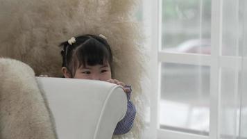 Portrait of Young Child Playing Hide and Seek in Living Room video