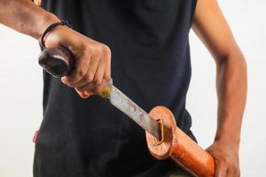 Man holding machete isolated photo