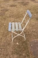 wooden chair on the grass photo