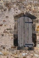 old door in stone wall photo